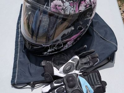 Women's motorcycle helmet size Extra Small and some Medium riding gloves.