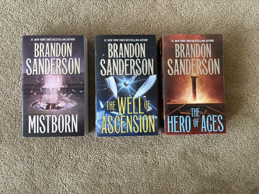 The Mistborn Trilogy, by Brandon Sanderson (paperbacks)